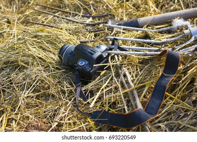 the camera is lying on a haystack