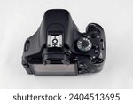 Camera with manual mode turned on (M) on a white isolated background.