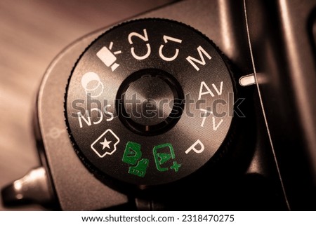 Camera mode dial with Aperture Value mode selected. Mode dial on a digital camera