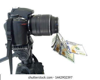 
Camera and money, earnings for photographs on photostocks