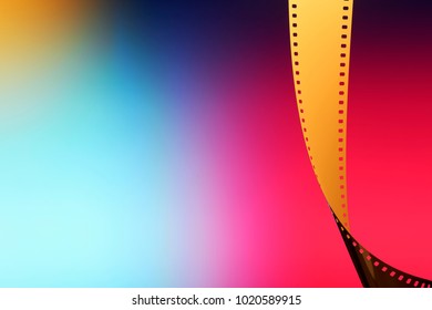 Camera Negative Film. Selective Focus On Film Perforation. Unprocessed Color Motion Picture Film. Industry Symbol For Shooting Process, Photochemical Laboratory Process And Film Archive Technology. 