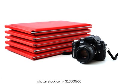 The Camera On The Background Of Photo Books. Graduation Photo