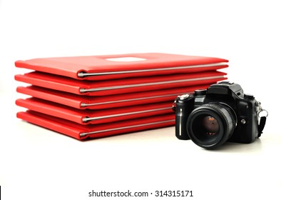 The Camera On The Background Of Photo Books. Graduation Photo.
