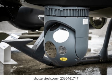 Camera sensor pods under a surveillance helicopter - Shutterstock ID 2366461747