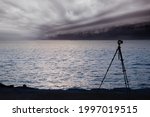 Camera stand on tripod photographing Cloudy storm in the sea before the rain. tornado storms cloud above the sea. Monsoon season. Hurricane Florence. Hurricane Katrina.