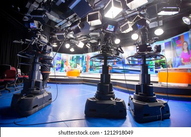 Camera In Studio Are Broadcasting Journalists Reading News.Blur Background Have Table For Reporter.