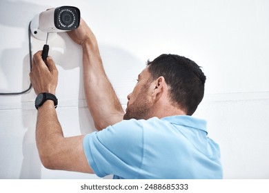 Camera, surveillance and installation man or wall, protection and crime monitoring or criminal activity. Broadcasting, video and live feed for control room, movement detection and vigilance in office - Powered by Shutterstock