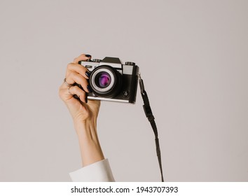 a camera in a woman's hands