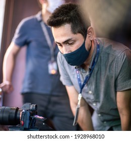 Cameraman Check Footage From Mirrorless While Wearing Mask Prevent Covid-19 Or Coronavirus Quarantine Pandemic And Protect Pm 2.5