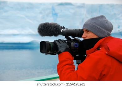 Cameraman Filming An Iceberg In Antarctica