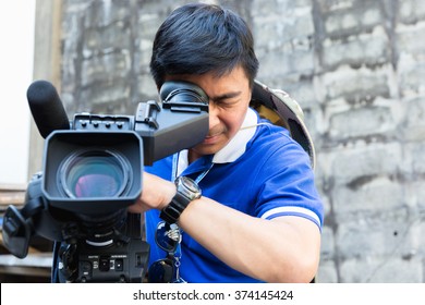 The Cameraman Filming Outdoor Event