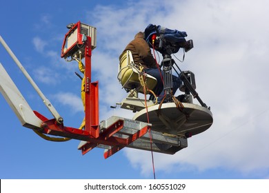 The Cameraman Filming An Outdoor Sporting Event In The Air