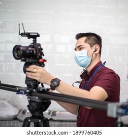 Cameraman Shooting By Mirrorless With Slider Dslr Video While Wearing Mask Prevent Covid-19 Or Coronavirus Quarantine Pandemic And Protect Pm 2.5