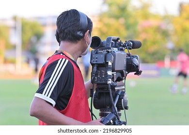 Cameraman Shooting Soccer Game.Professional Sport Media At The Stadium During Football Matches.TV Media Broadcasting During The Sport Tournament.