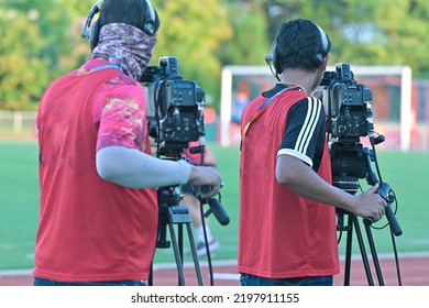 Cameraman Shooting Soccer Game.Professional Sport Media At The Stadium During Football Matches.TV Media Broadcasting During The Sport Tournament.