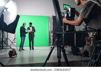 Cameraman shooting TV program in studio