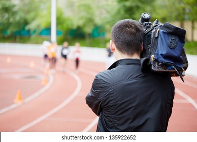 Cameraman Shoots Running Races, View From Back