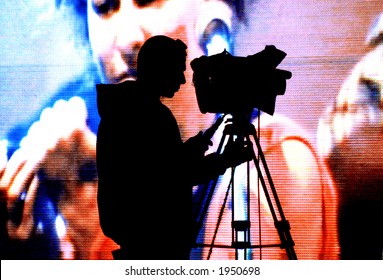 cameraman silhouette on a huge screen - Powered by Shutterstock