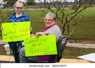 Cameron, NC/United States - 10/12/209:Parents And School-age Children, Many With “Open Our Schools” Signs, Hold A Rally Outside Union Pines High School Ahead Of A Vote By The Moore County Board Of Edu