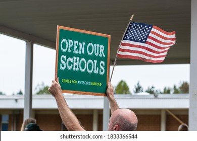 Cameron, NC/United States - 10/12/209:Parents And School-age Children, Many With “Open Our Schools” Signs, Hold A Rally Outside Union Pines High School Ahead Of A Vote By The Moore County Board Of Edu