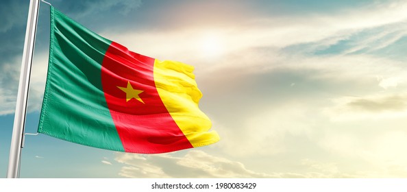 Cameroon national flag waving in beautiful sunlight.