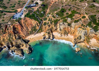 Camilo Beach in Lagos, Algarve - Portugal. Portuguese southern golden coast cliffs. Sunny day aerial view - Powered by Shutterstock