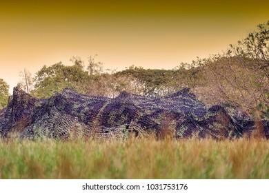 Camouflage Military Army Base Tent In The Field
