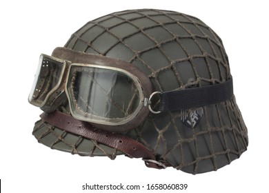 Camouflaged Nazi Army German Helmet With Mesh Helmet Net Cover And Protective Goggles Isolated On White Background