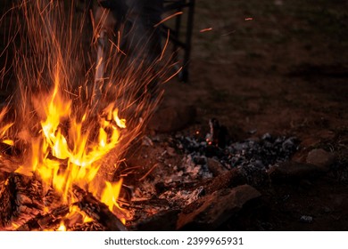 Camp Fire Outside Day Light Evening Shoveling Coals Fire Pit Blurred Long Shutter - Powered by Shutterstock