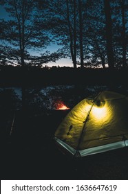 Camp Site At Night With Campfire And Tent