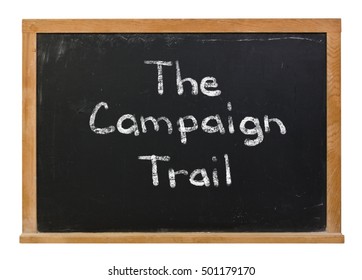 The Campaign Trail Written In White Chalk On A Black Chalkboard Isolated On White