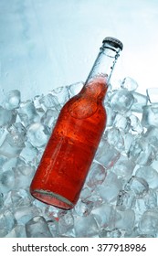 Campari  Bottle Isolated On The Ice Cubes Background