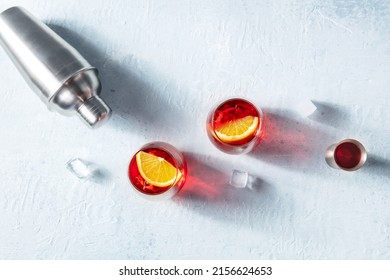 Campari Orange Cocktail With A Jigger And A Shaker, Shot From Above With Copy Space