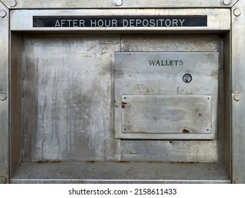 CAMPBELL RIVER, CANADA - Feb 26, 2022: A closeup of an after hours depository box on the outside of a bank   With a drawer that opens that has the words wallet on it   Opens with a key 