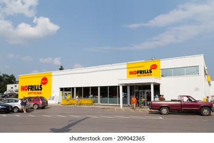 CAMPBELLFORD, CANADA - 2ND AUGUST 2014: The outside of a No Frills Store during the day. People can be seen outside the store