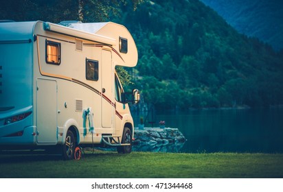 Camper Camping at the Glacier Lake. Camper Van Vacation. - Shutterstock ID 471344468
