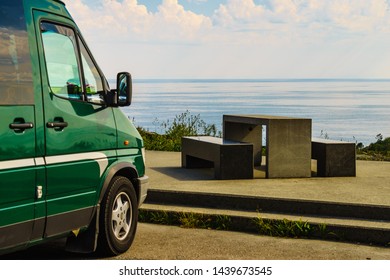 Camper Car On Rest Stop Area, Viewpoint With Stone Seating Bench On Sea Ocean Shore. Attractions Along Lofoten Islands In Norway.