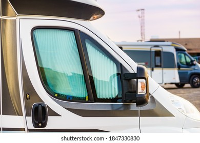 Camper with internal thermal screen blind at window pane. Camping on nature. Holidays and travel in motor home.