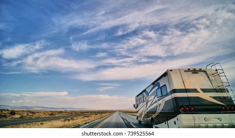 camper motorhome on open highway in desert