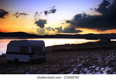 Camper Near Lake In Stunning HDR Sunrise Winter Landscape 