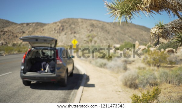 A camper on a desert highway background plate\
for compositing