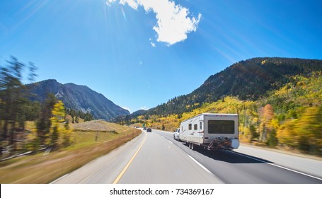 Camper On Road Trip On Road