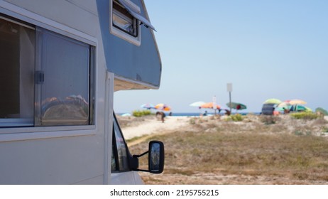 Camper Parked In Front Of The Coast On The Mediterranean Beach Of The Island Of Sardinia, Lifestyle Nomad Life Of Travel Around The World