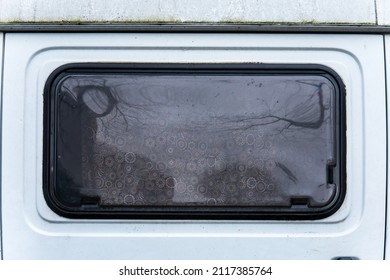 camper plastic window with nice florets curtain. car glass reflection.
