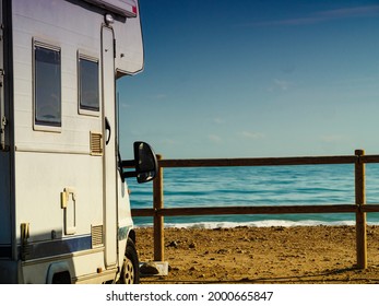 Camper Rv Caravan On Mediterranean Coast In Spain. Wild Camping On Nature Beach. Holidays And Traveling In Motor Home. Visiting Warm Winter Travel Destinations.