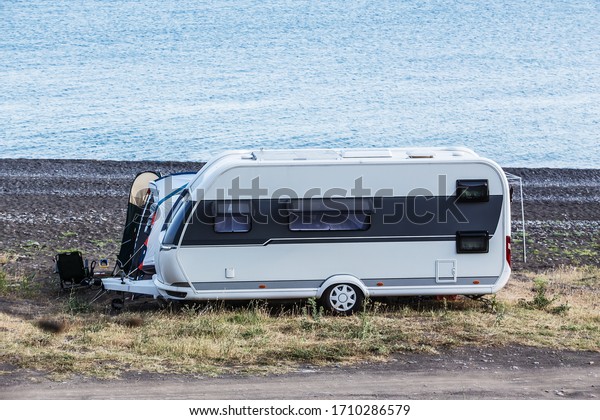 Camper\
trailer by the sea near the lagoon with\
cape