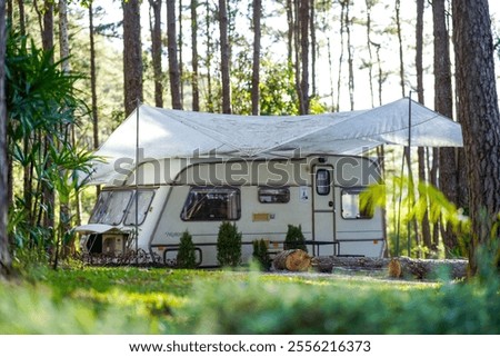 Similar – Image, Stock Photo Women resting and talking lying in tent over car