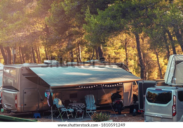 Campervan caravan vehicle home camper mobile
motor home. Well-equipped campervan. Owners can either sleep inside
of it, either in tent on the roof of campervan. Perfect mobile
house for nomad
people.