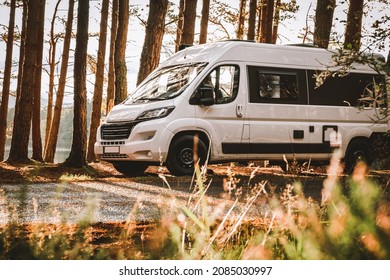 Campervan in the forest near a lake