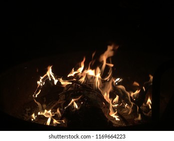 Campfire dancing at night